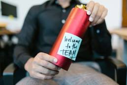 HR manager guiding a new hire through onboarding checklist